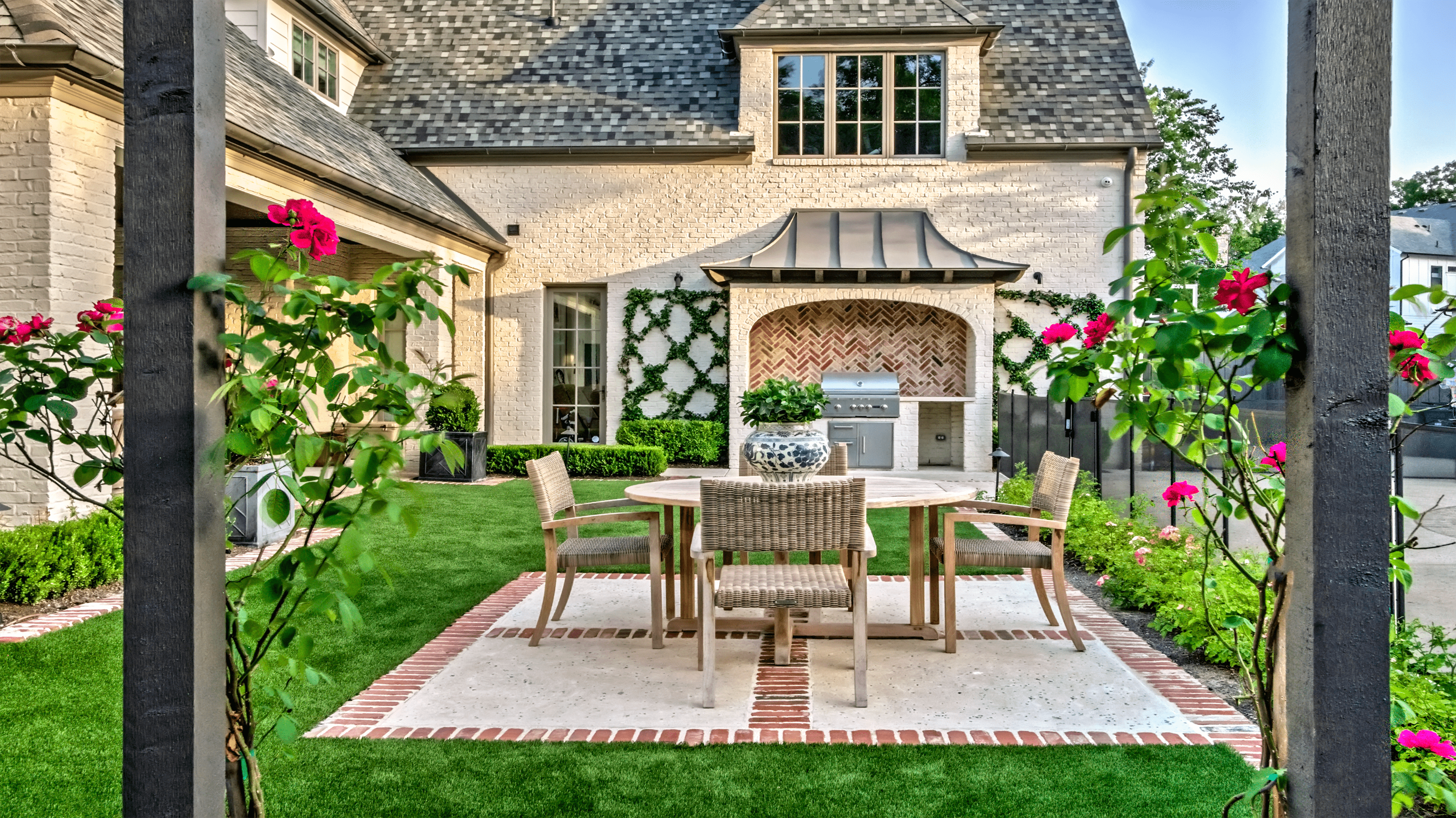 residential backyard formal gardens brick patio outdoor furniture lawn border plantings